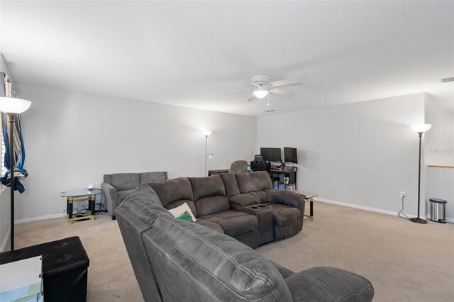 carpeted living room featuring ceiling fan