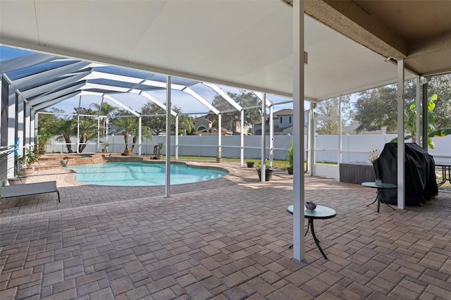 view of pool featuring area for grilling, a lanai, and a patio