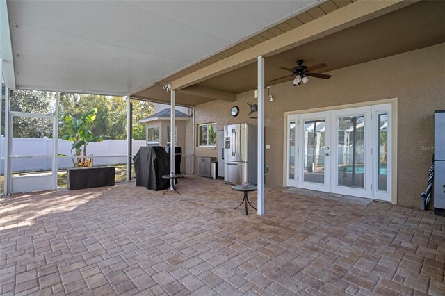 view of patio / terrace featuring ceiling fan, area for grilling, and french doors