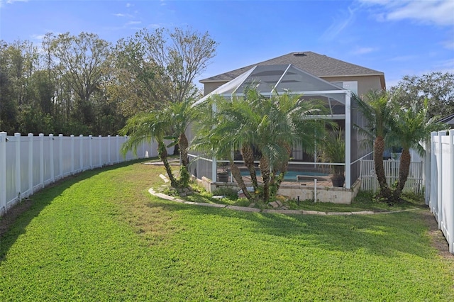 view of yard featuring a pool and a lanai