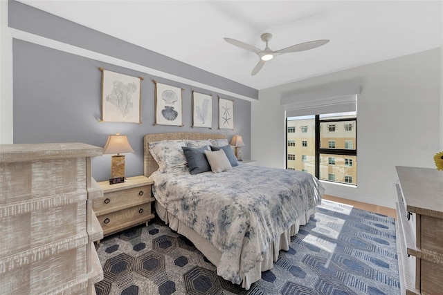 bedroom with hardwood / wood-style floors and ceiling fan