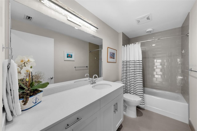 full bathroom featuring tile patterned flooring, vanity, toilet, and shower / bath combo with shower curtain