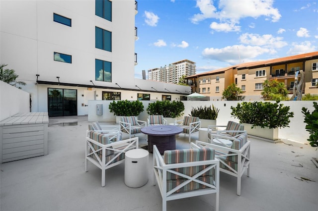 view of patio with a fire pit