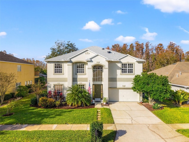 view of front property with a front lawn and a garage