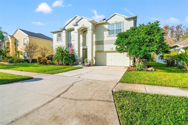 view of front facade featuring a front yard and a garage