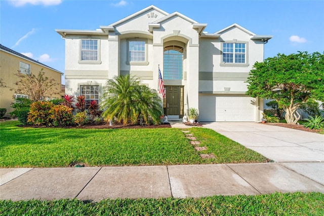 view of front facade with a front yard and a garage