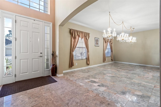 entryway featuring an inviting chandelier