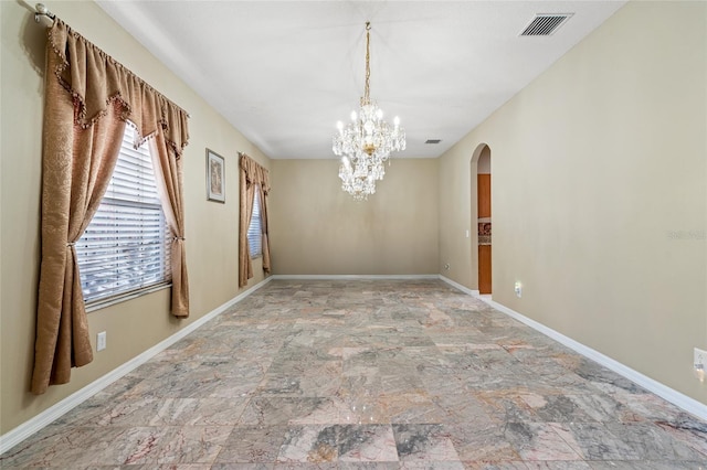 unfurnished dining area with an inviting chandelier