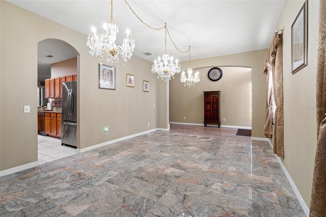 unfurnished dining area with an inviting chandelier