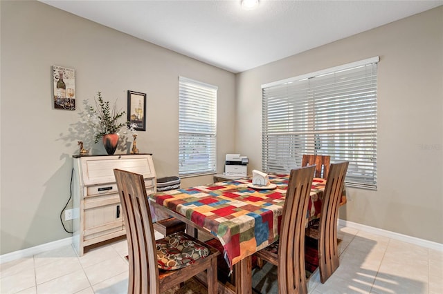 dining room with light tile patterned flooring