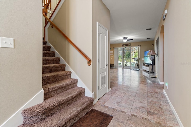 interior space featuring ceiling fan