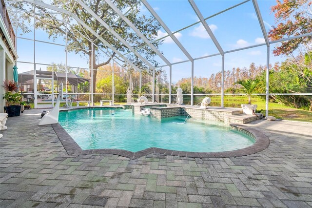 view of swimming pool with a lanai, a patio area, an in ground hot tub, and pool water feature