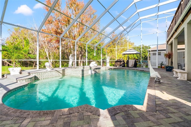 view of swimming pool featuring a gazebo, a patio, and a lanai