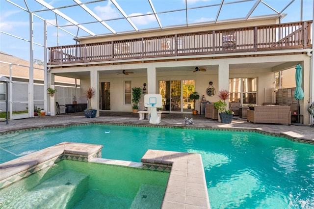 view of swimming pool featuring ceiling fan, a patio area, an outdoor hangout area, and an in ground hot tub