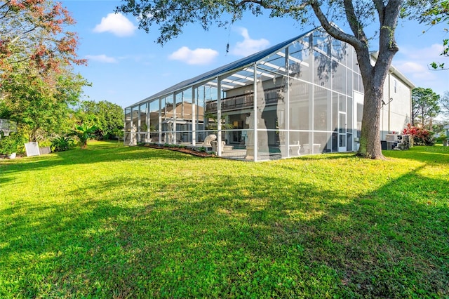 exterior space with a lawn and a lanai