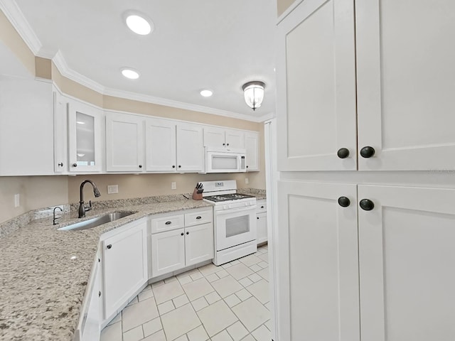 kitchen with white cabinetry, sink, white appliances, and ornamental molding