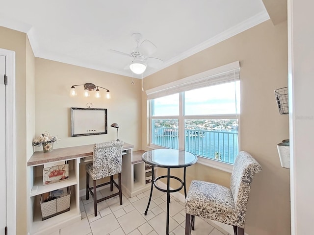 living area with ceiling fan, a water view, light tile patterned floors, and ornamental molding