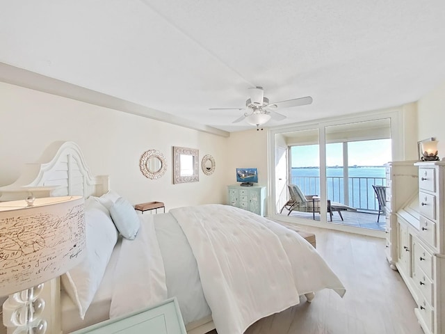 bedroom featuring ceiling fan and access to exterior