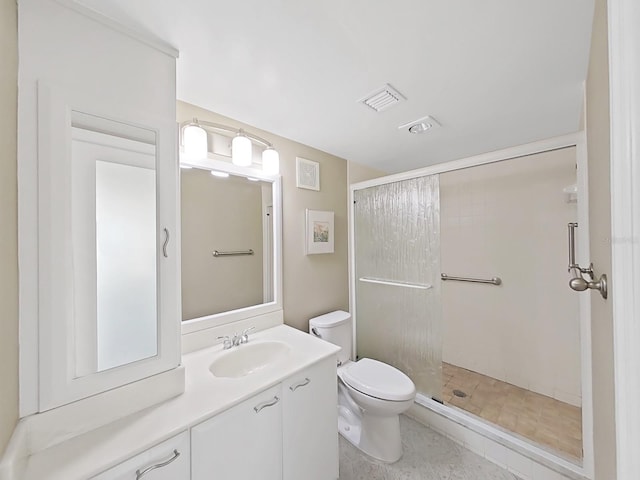 bathroom with vanity, toilet, and walk in shower