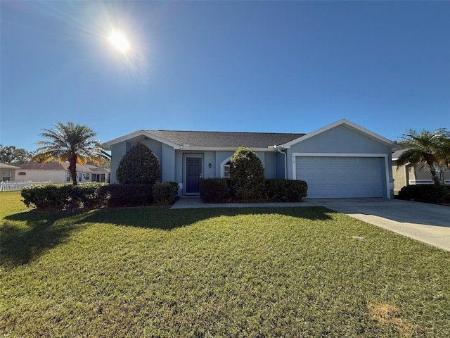 ranch-style house featuring a garage and a front lawn