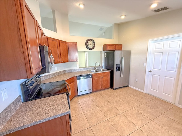 kitchen featuring light tile patterned flooring, sink, and stainless steel appliances