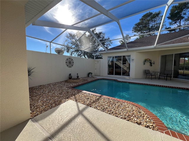 view of pool with a lanai and a patio area