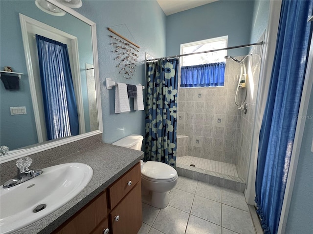 bathroom with vanity, toilet, tile patterned flooring, and a shower with shower curtain