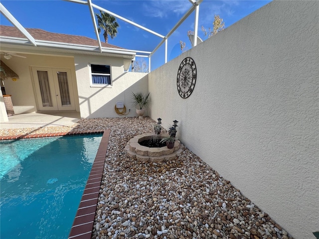 view of swimming pool with a patio area and french doors