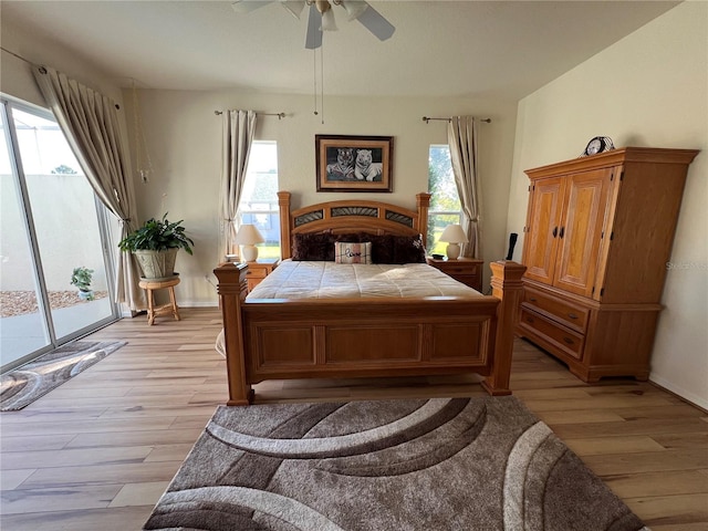 bedroom with light wood-type flooring and multiple windows