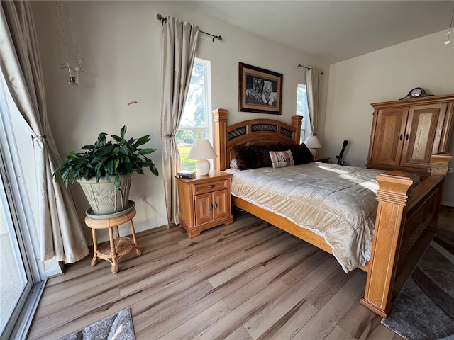 bedroom with light hardwood / wood-style flooring