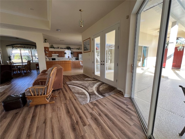 interior space with french doors and wood-type flooring