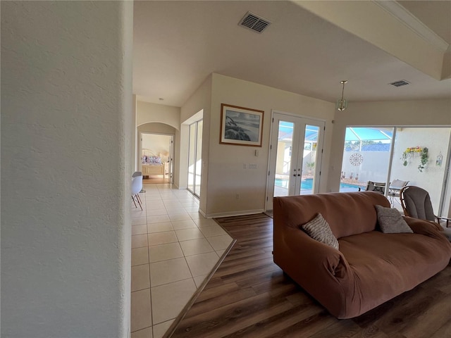 living room with french doors and wood-type flooring