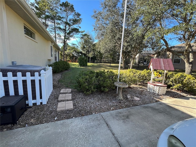 view of yard with cooling unit and a patio