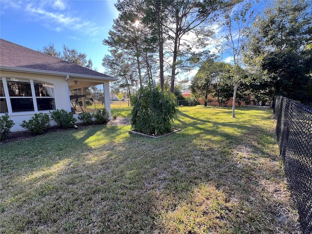 view of yard with ceiling fan