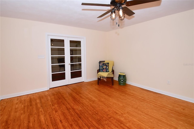 unfurnished room with ceiling fan, wood-type flooring, and french doors