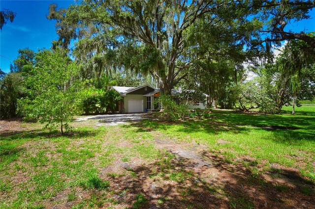 view of yard with a garage