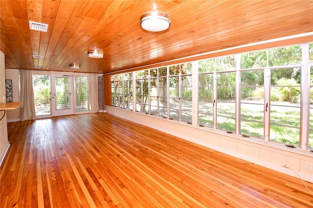 unfurnished sunroom with wooden ceiling and lofted ceiling