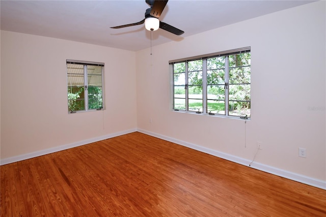 unfurnished room featuring ceiling fan and wood-type flooring