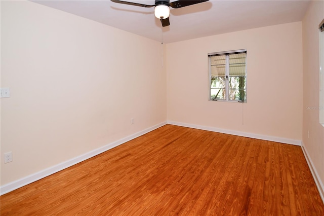 unfurnished room featuring hardwood / wood-style flooring and ceiling fan