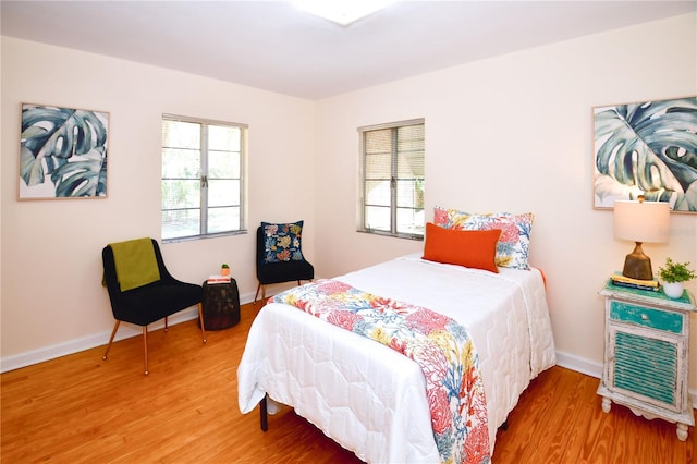 bedroom with hardwood / wood-style floors