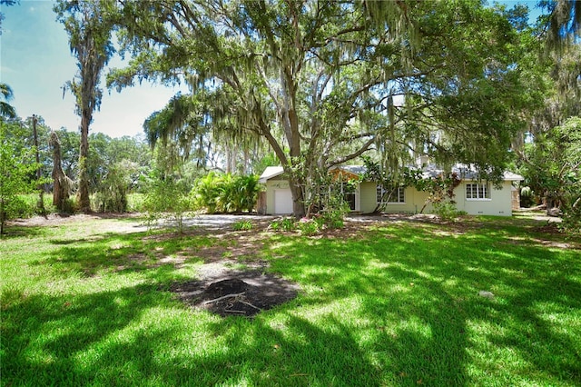 view of yard featuring a garage