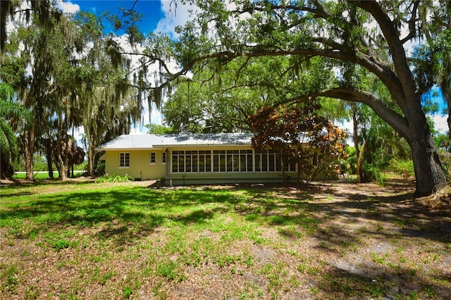 view of yard featuring a sunroom