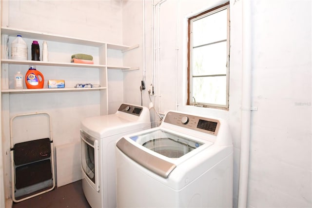 laundry room featuring separate washer and dryer and plenty of natural light