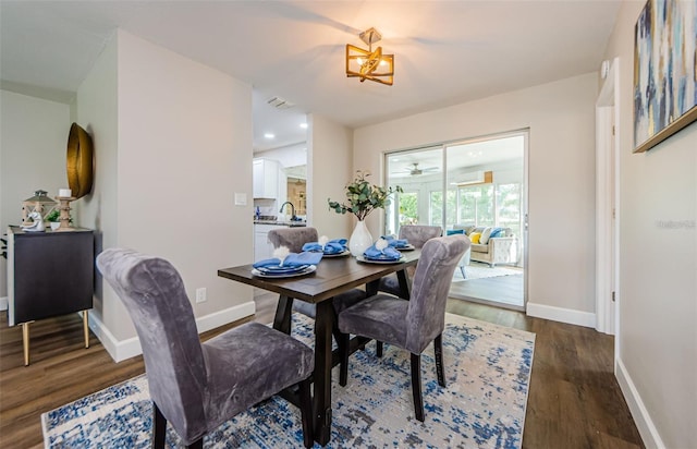 dining space featuring dark hardwood / wood-style flooring