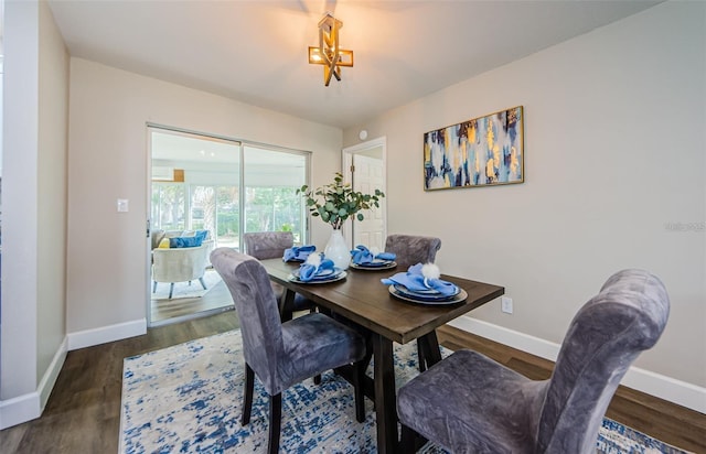 dining area with dark wood-type flooring