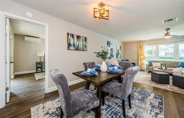 dining space with a wall mounted AC, ceiling fan, and dark wood-type flooring