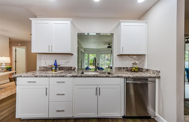 kitchen featuring dishwasher, dark wood-type flooring, sink, light stone countertops, and white cabinetry