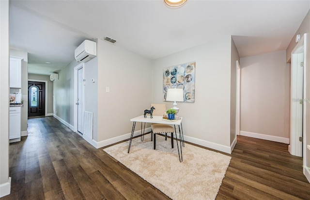 hallway featuring dark wood-type flooring and a wall unit AC