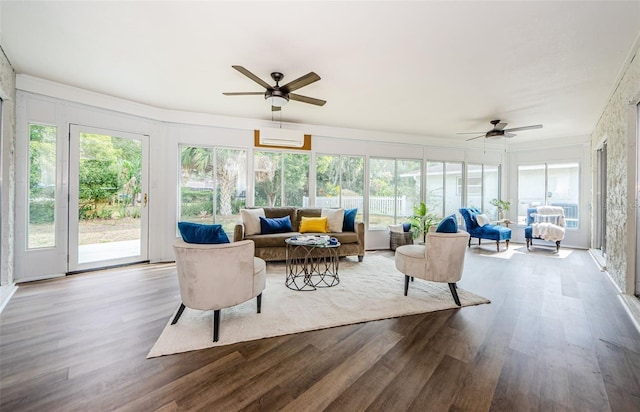 sunroom / solarium with ceiling fan and a wall unit AC