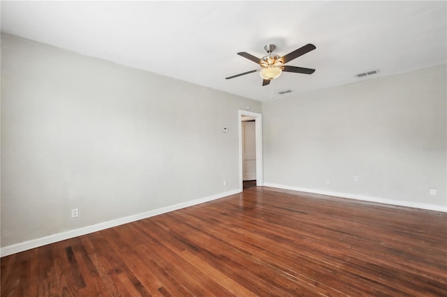 empty room featuring ceiling fan and dark hardwood / wood-style floors